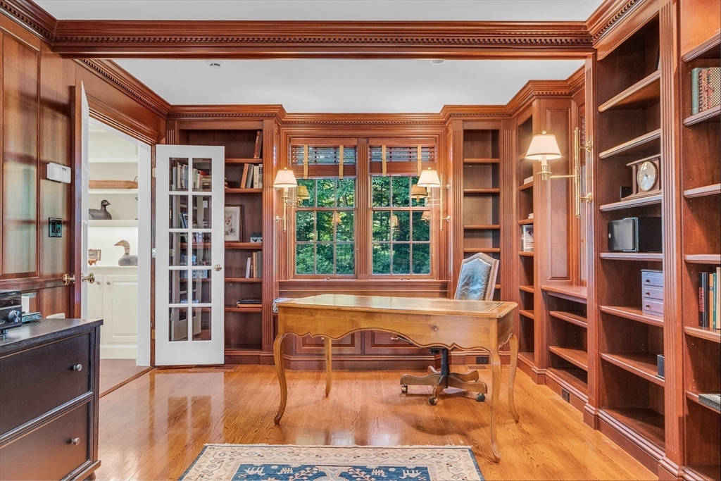 15 Rockridge Road Wellesley, MA 02481 - Photo 20 of 36 a living room filled with furniture hardwood floor and a book shelf
