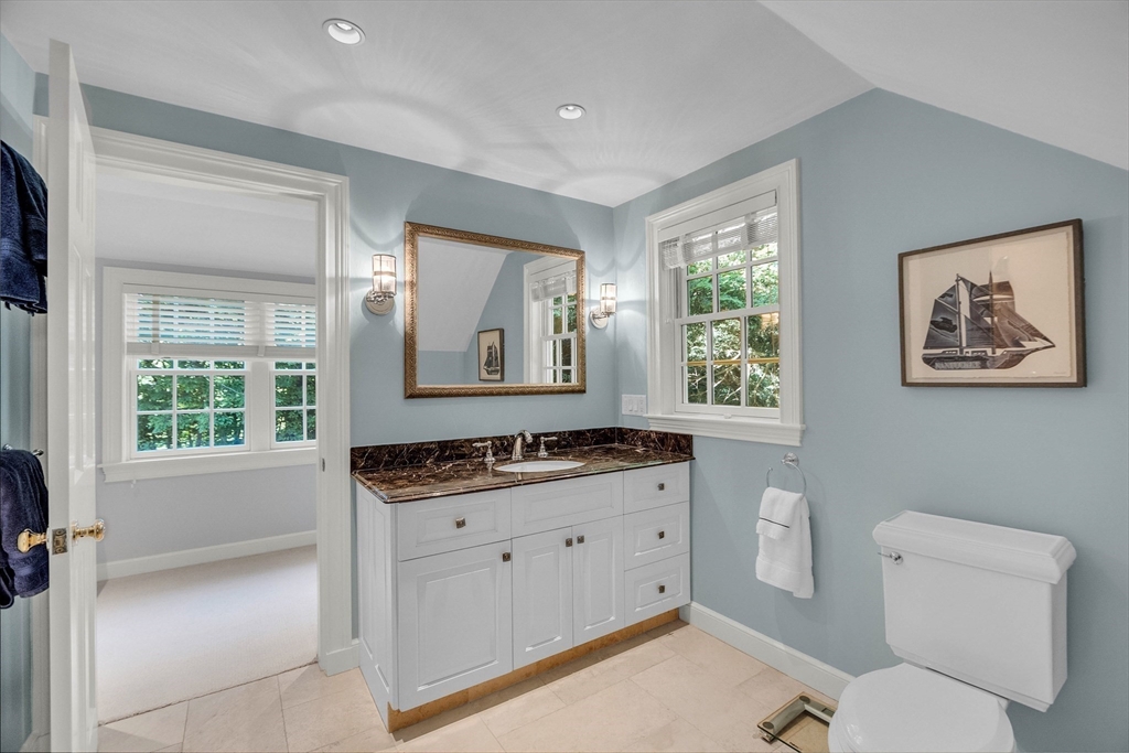 15 Rockridge Road Wellesley, MA 02481 - Photo 24 of 36 a bathroom with a granite countertop toilet sink and mirror