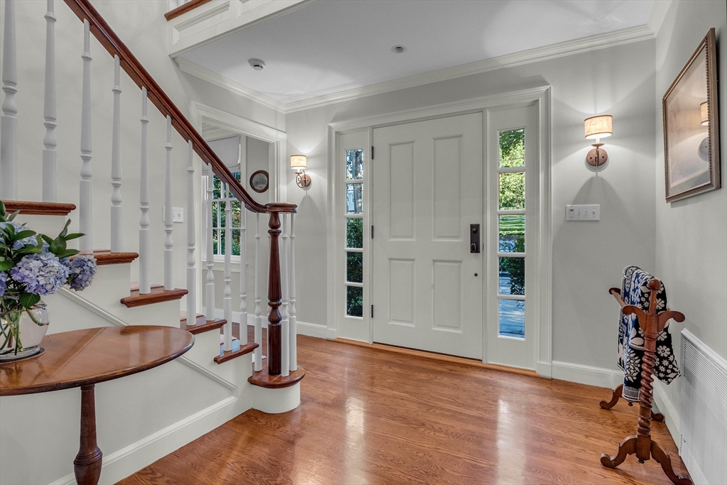 15 Rockridge Road Wellesley, MA 02481 - Photo 3 of 36 a view of entryway with livingroom and wooden floor