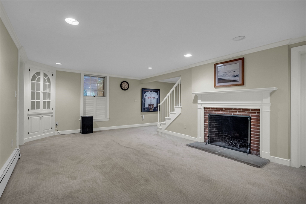15 Rockridge Road Wellesley, MA 02481 - Photo 34 of 36 an empty room with furniture and a fireplace