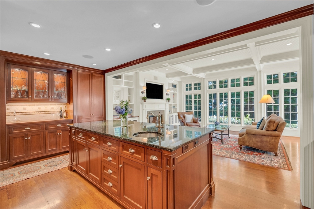 15 Rockridge Road Wellesley, MA 02481 - Photo 6 of 36 a dining hall with stainless steel appliances granite countertop a sink and a refrigerator
