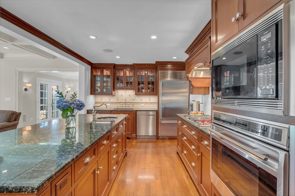 15 Rockridge Road Wellesley, MA 02481 - Photo 7 of 36 a kitchen with counter top space a sink and stainless steel appliances
