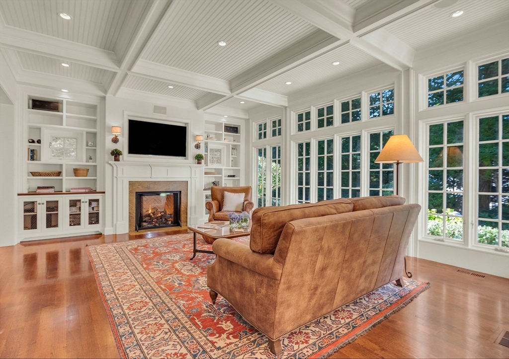 15 Rockridge Road Wellesley, MA 02481 - Photo 8 of 36 a living room with furniture a flat screen tv and a fireplace