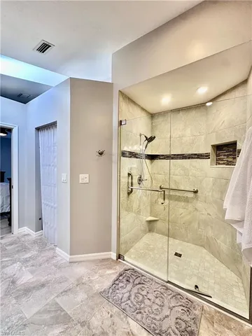 a bathroom with a shower and a sink