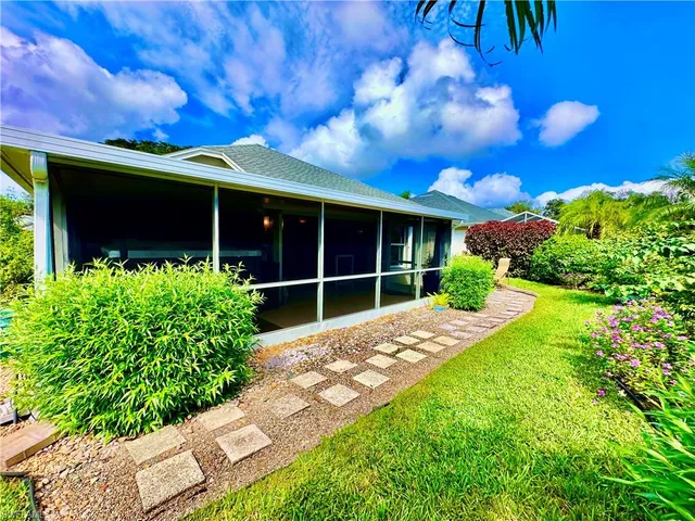 a view of a garden with chairs