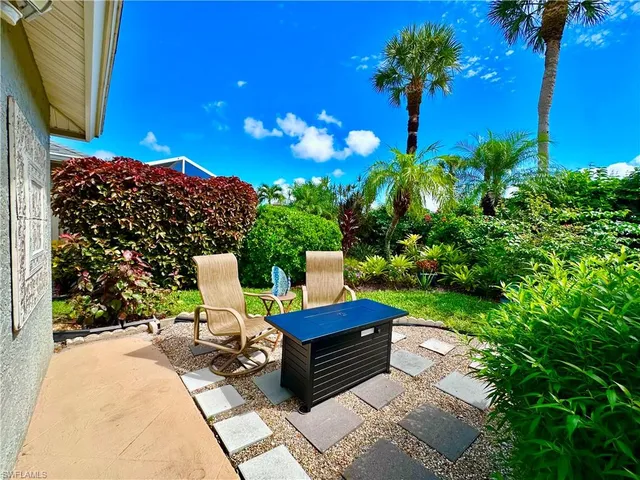 a view of a livingroom with furniture and a flat screen tv