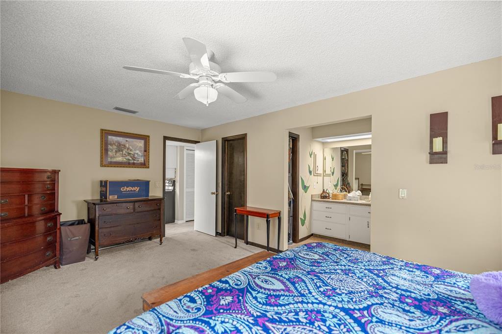 761 South Jeanne Avenue Inverness, FL 34453 - Photo 13 of 33 a bedroom with a bed and dresser