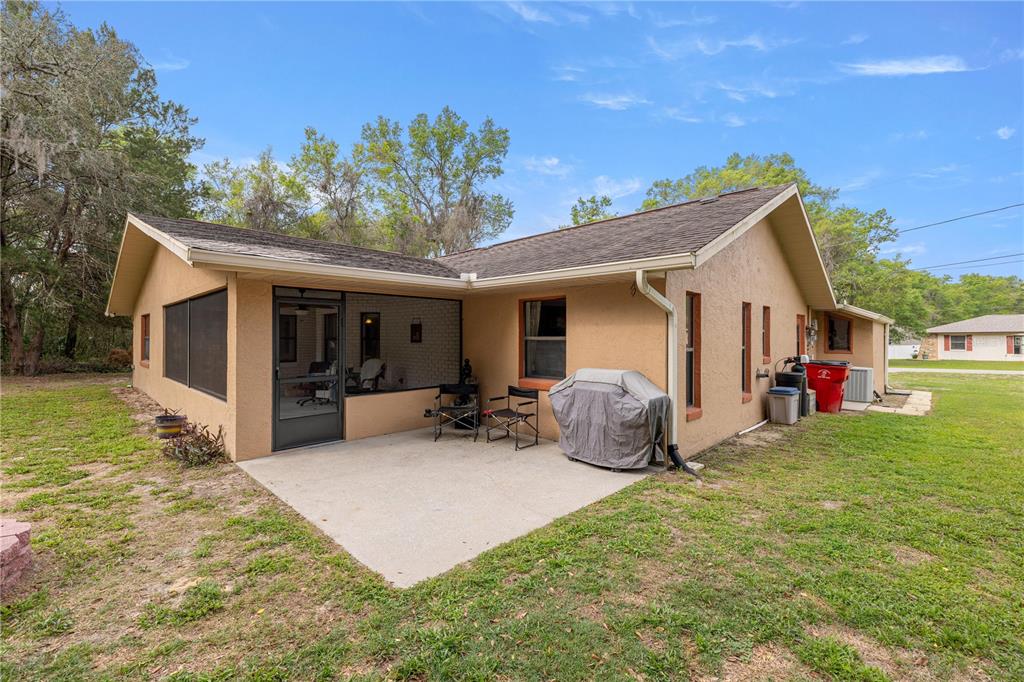 761 South Jeanne Avenue Inverness, FL 34453 - Photo 25 of 33 a view of a house with backyard and sitting area