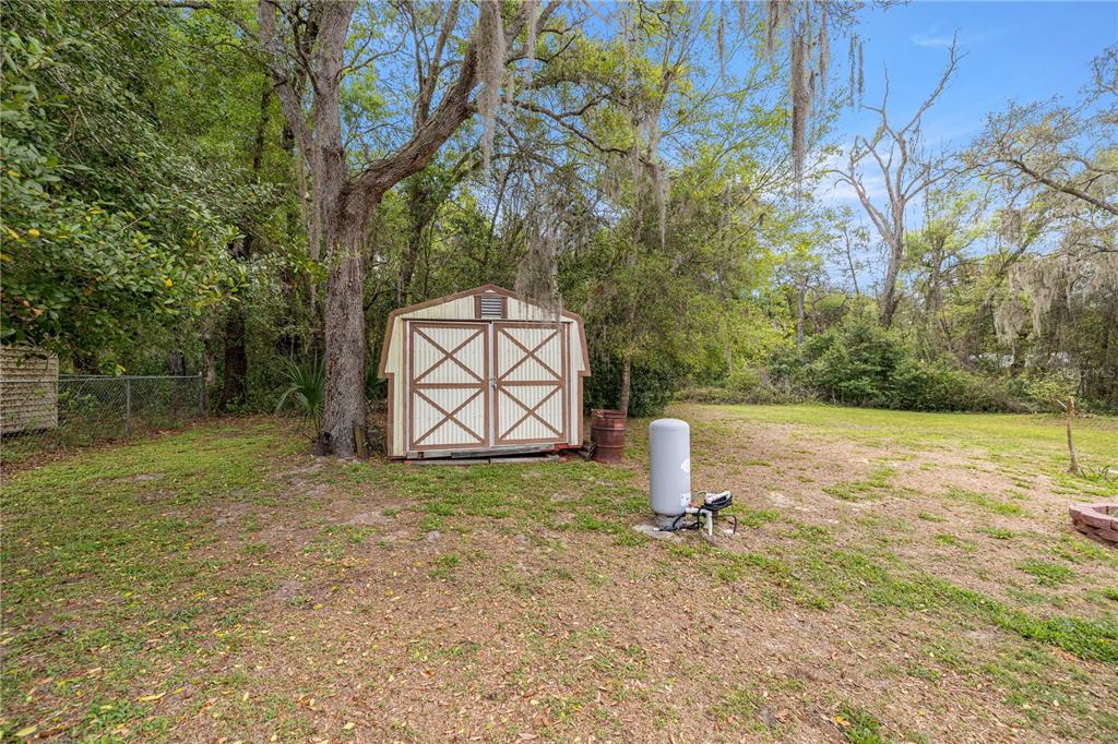 761 South Jeanne Avenue Inverness, FL 34453 - Photo 28 of 33 a backyard of a house with lots of green space