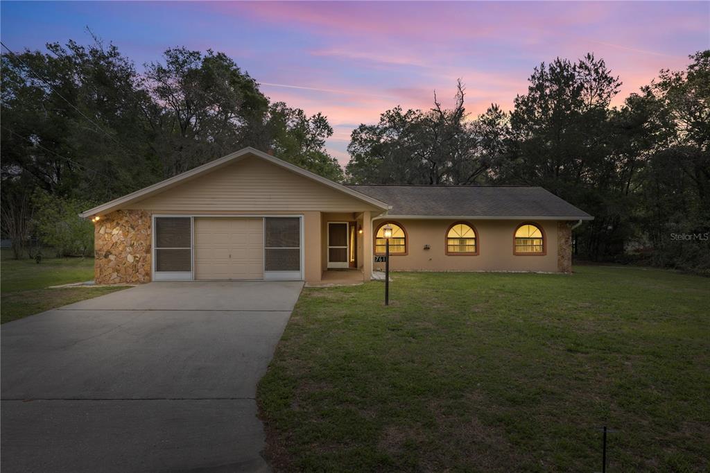 761 South Jeanne Avenue Inverness, FL 34453 - Photo 5 of 33 a view of a trees in front of a house with a yard