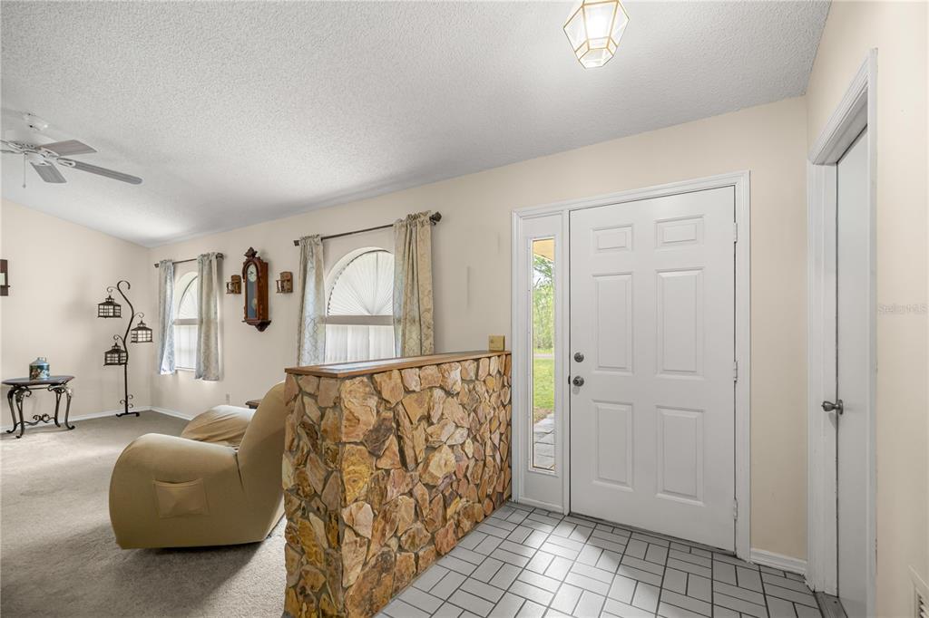 761 South Jeanne Avenue Inverness, FL 34453 - Photo 6 of 33 a view of a livingroom with furniture and hardwood floor