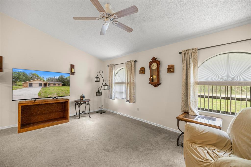 761 South Jeanne Avenue Inverness, FL 34453 - Photo 7 of 33 a living room with furniture and a window