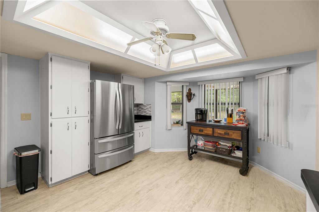 761 South Jeanne Avenue Inverness, FL 34453 - Photo 10 of 33 a view of kitchen with furniture and a ceiling fan