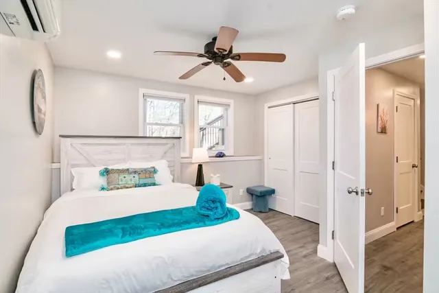 a bedroom with a bed and window