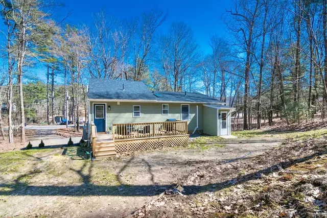 a house view with a sitting space and garden space