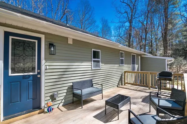 a view of a patio with a table and chairs
