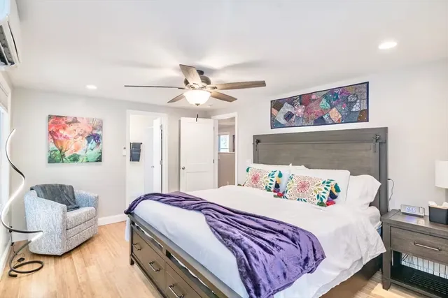 a bedroom with a bed and a couch