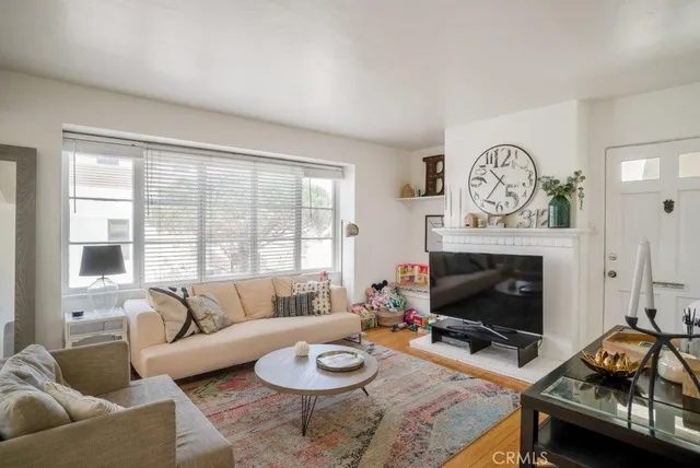 a bathroom with a sink toilet and window