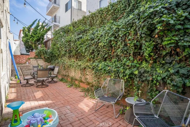 a kitchen with sink stove and cabinets