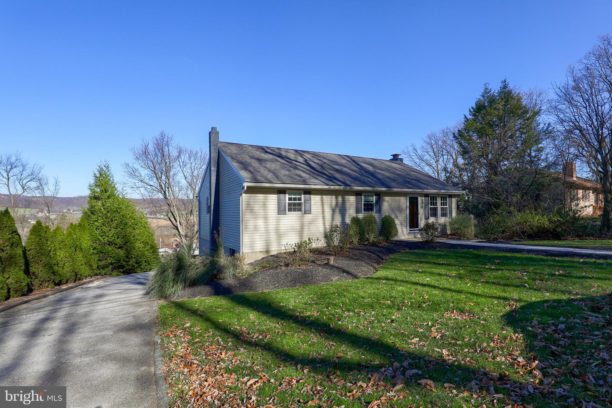 540 Blue Lake Road Denver, PA 17517 - Photo 11 of 63 a front view of a house with garden