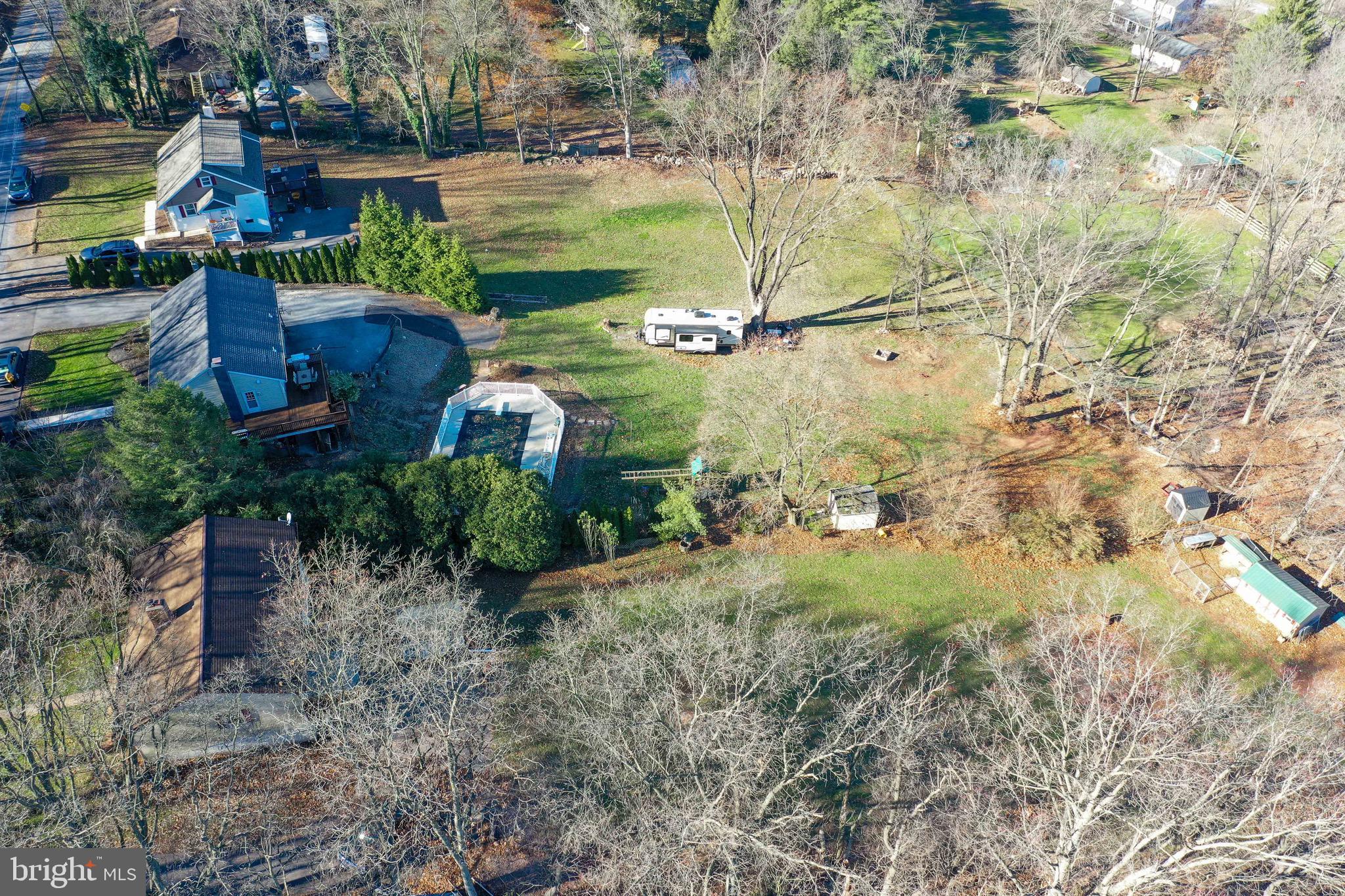 540 Blue Lake Road Denver, PA 17517 - Photo 33 of 63 a view of a yard with plants and large trees