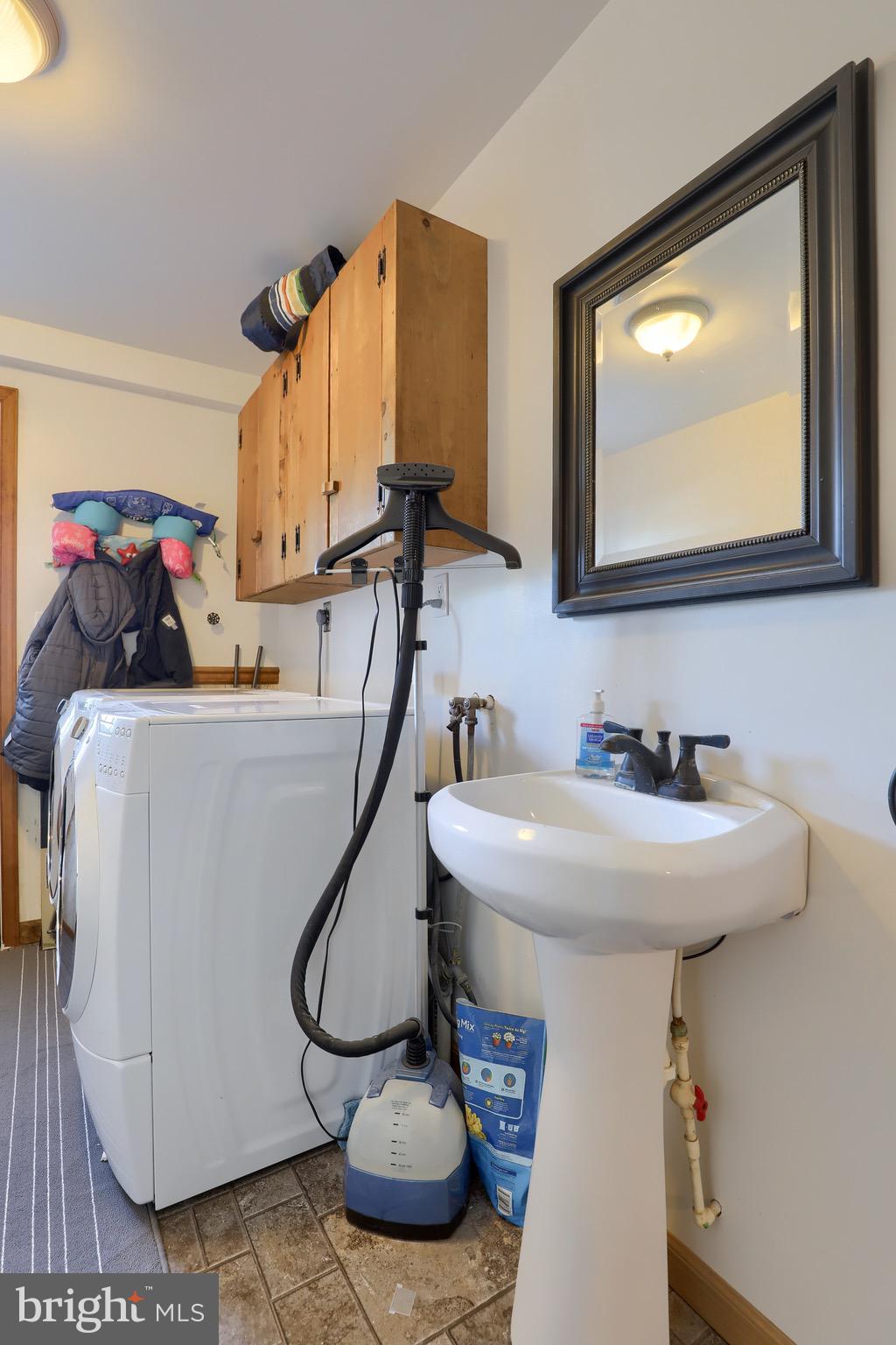540 Blue Lake Road Denver, PA 17517 - Photo 60 of 63 a bathroom with a sink a mirror and cabinets