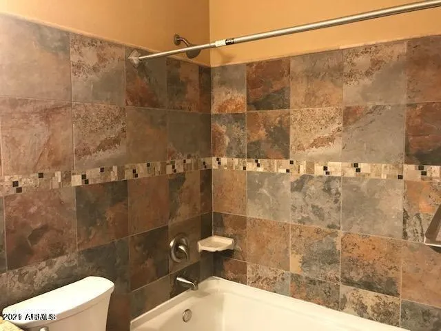 a bathroom with a sink and toilet