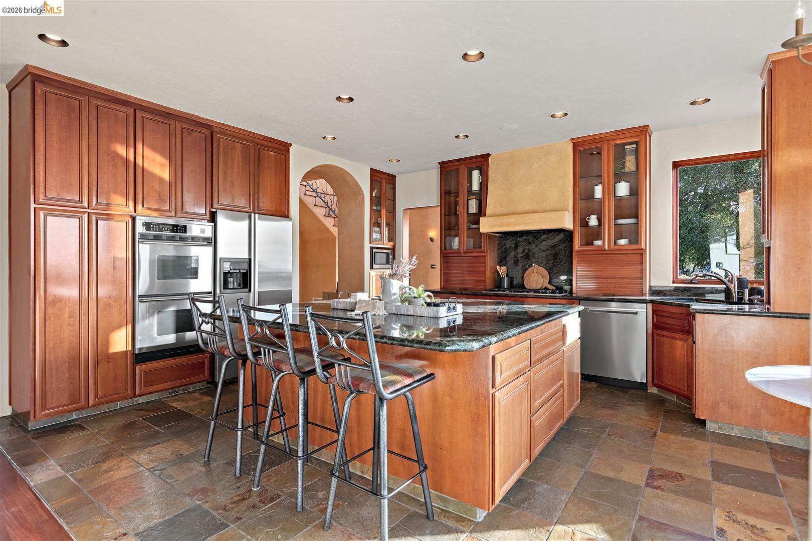 29 Live Oak Road Berkeley, CA 94705 - Photo 11 of 30 a kitchen with lots of counter top space and dining table