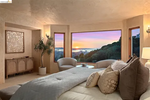 a bedroom with a bed and glass window