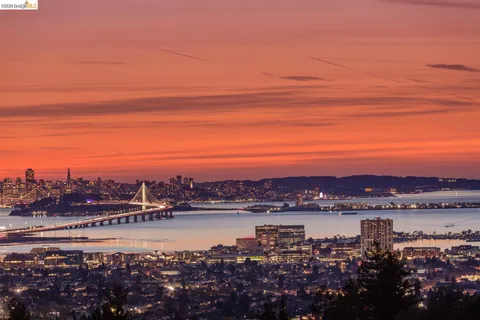 a view of a lake with sunset