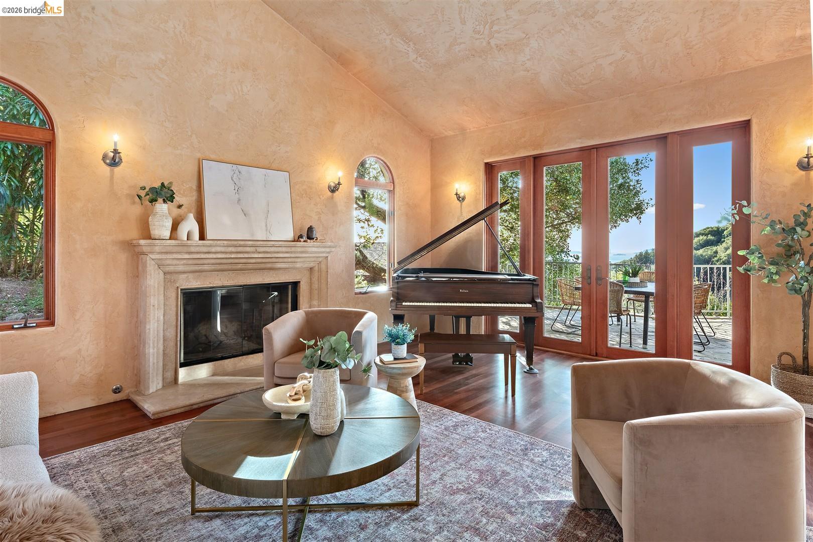 29 Live Oak Road Berkeley, CA 94705 - Photo 6 of 30 a living room with furniture a fireplace and a floor to ceiling window