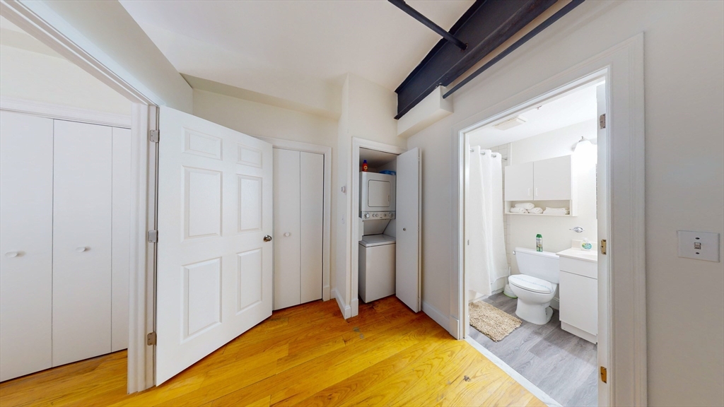19 Stanhope Street, Unit 1D Boston, MA 02116 - Photo 19 of 30 a bathroom with a granite countertop sink and a toilet