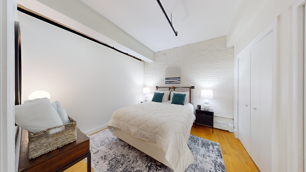 19 Stanhope Street, Unit 1D Boston, MA 02116 - Photo 21 of 30 a room with bed and furniture