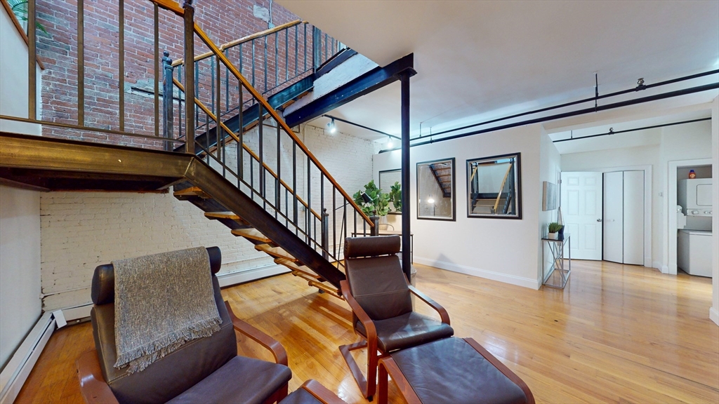 19 Stanhope Street, Unit 1D Boston, MA 02116 - Photo 30 of 30 a view of entryway and hall with wooden floor