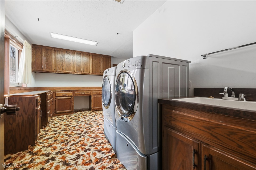 7014 River Styx Road Medina, OH 44256 - Photo 19 of 49 Laundry room featuring cabinet space and separate washer and dryer
