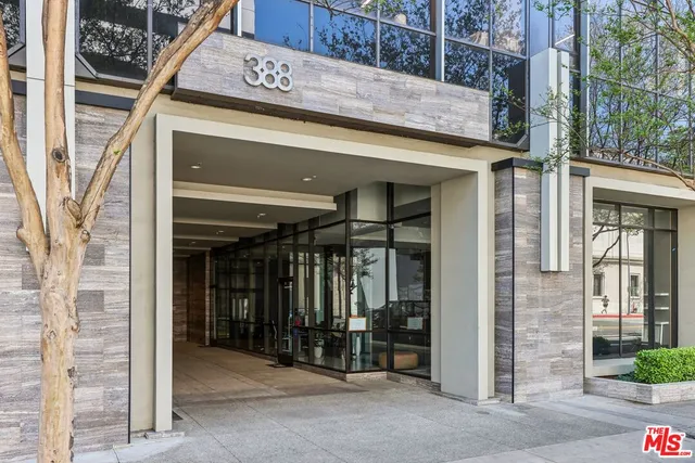 a view of a tall building from a balcony