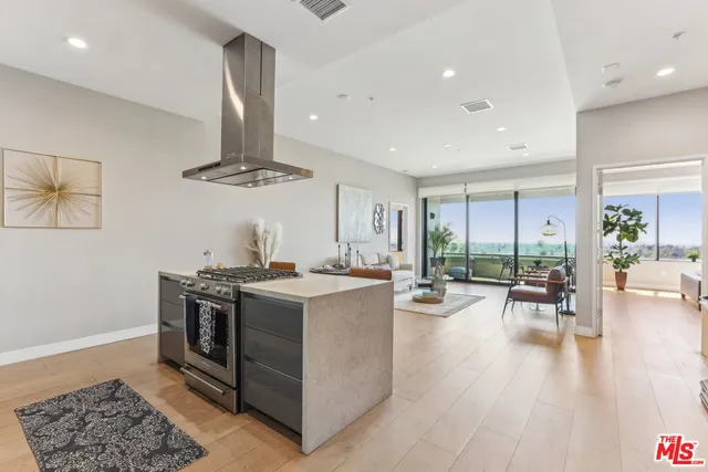 a kitchen with a sink cabinets and stainless steel appliances
