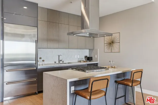a very nice looking dining room with a large dining table and chairs