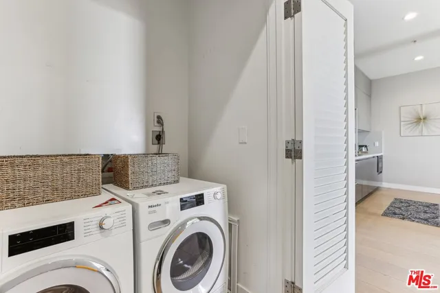 a bedroom with a bed a plant and a window