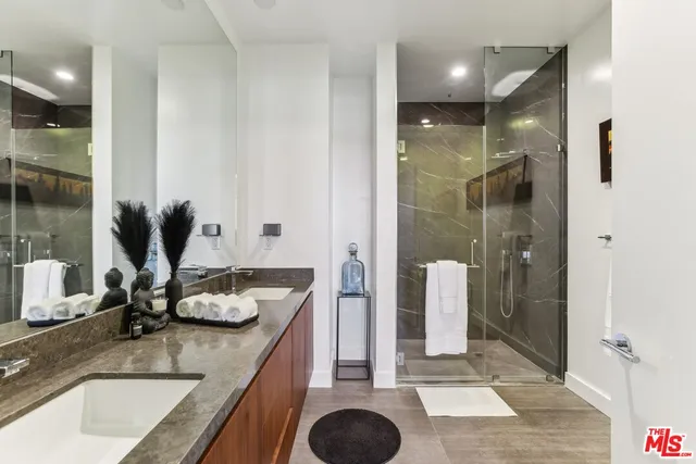 a spacious bedroom with a large window and a bed