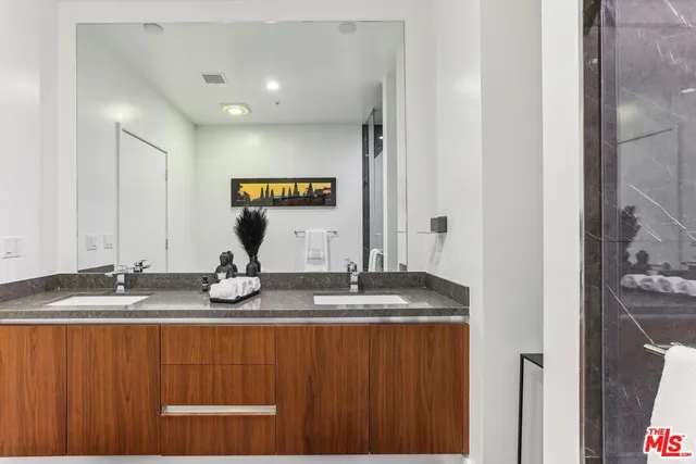 a bedroom with a large bed and a large window