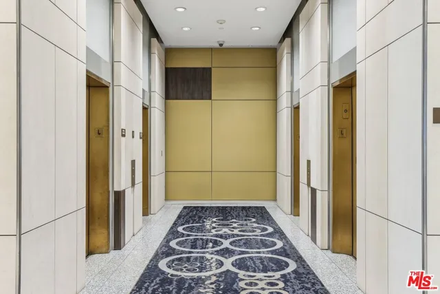 a view of a bedroom with wooden floor