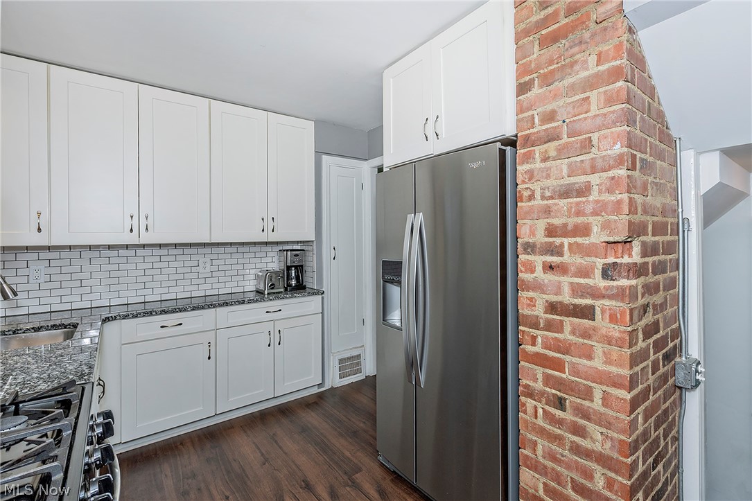 4189 Ellison Road South Euclid, OH 44121 - Photo 16 of 41 Another view of the exposed brick and well appointed kitchen
