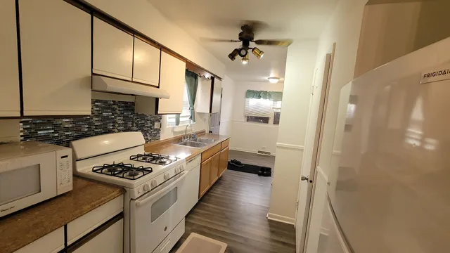a kitchen with a stove and a refrigerator
