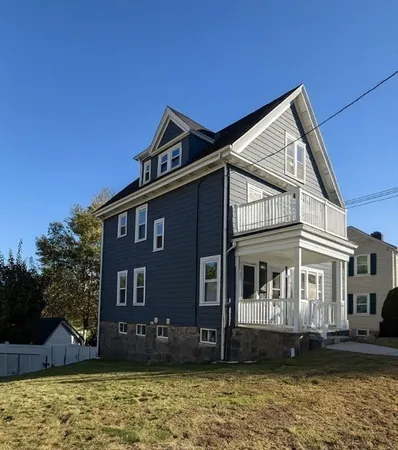 a view of a house with a yard