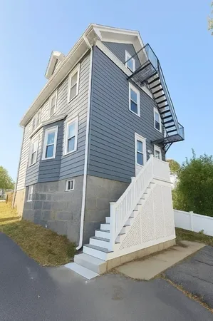 a view of a house with a yard and garage