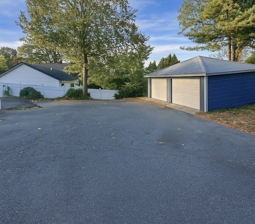 145 Lagrange Street, Unit 2 Boston, MA 02132 - Photo 17 of 17 a view of a house with a yard and garage