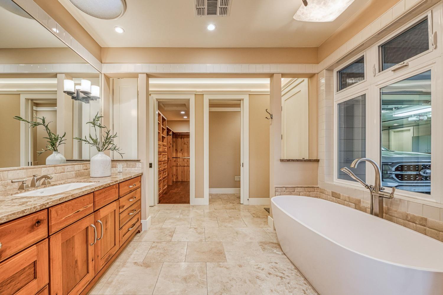 1098 South Rainbow Route Sanger, CA 93657 - Photo 23 of 70 a spacious bathroom with a large tub shower and sink