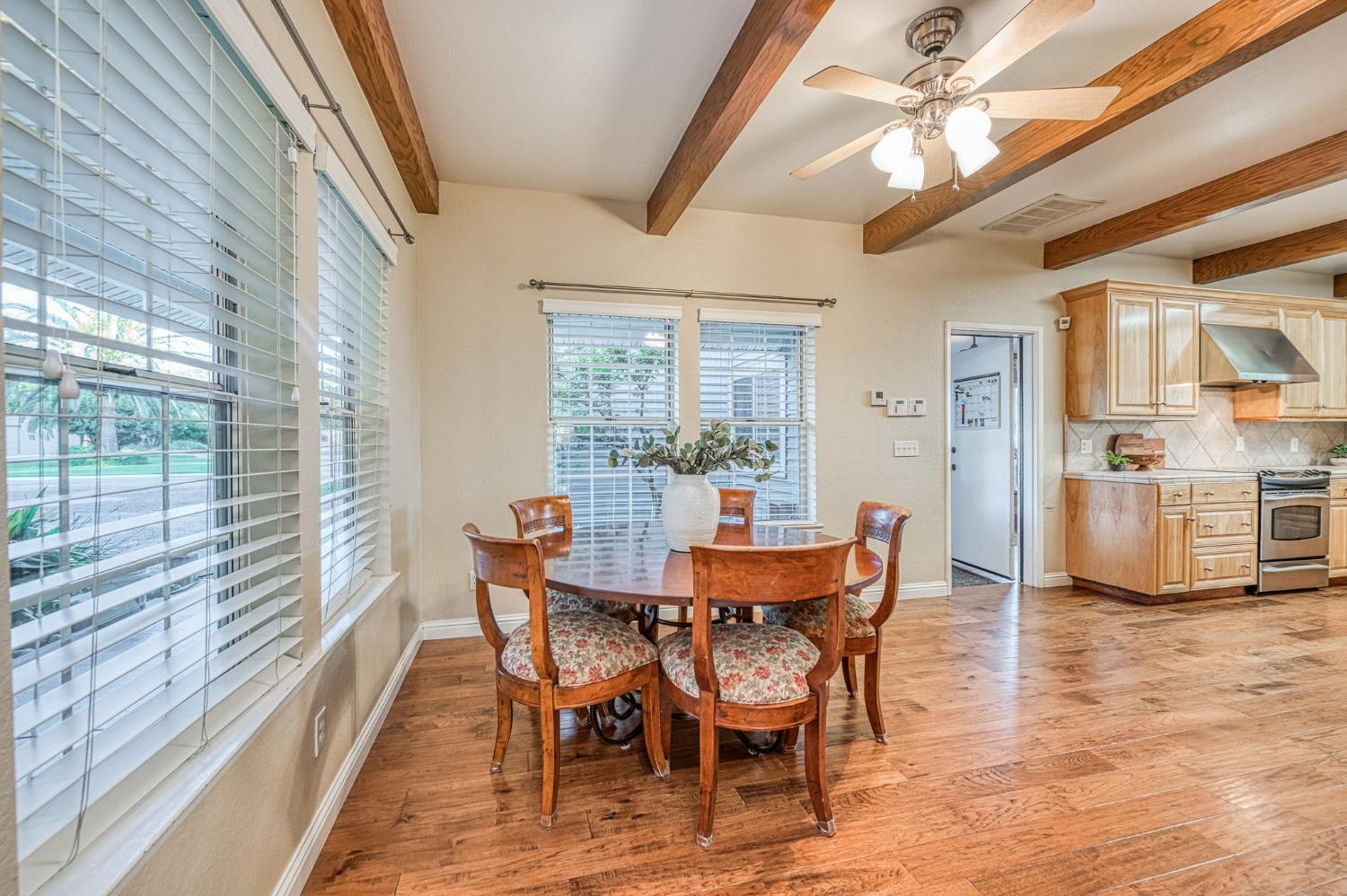 1098 South Rainbow Route Sanger, CA 93657 - Photo 39 of 70 a view of a dining room with furniture window and wooden floor