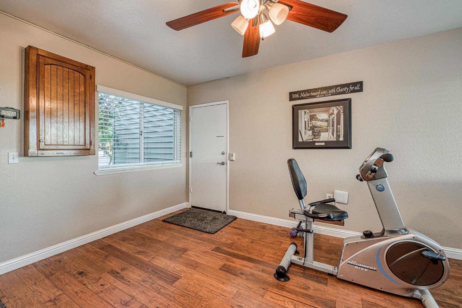1098 South Rainbow Route Sanger, CA 93657 - Photo 43 of 70 a view of a room with gym equipment